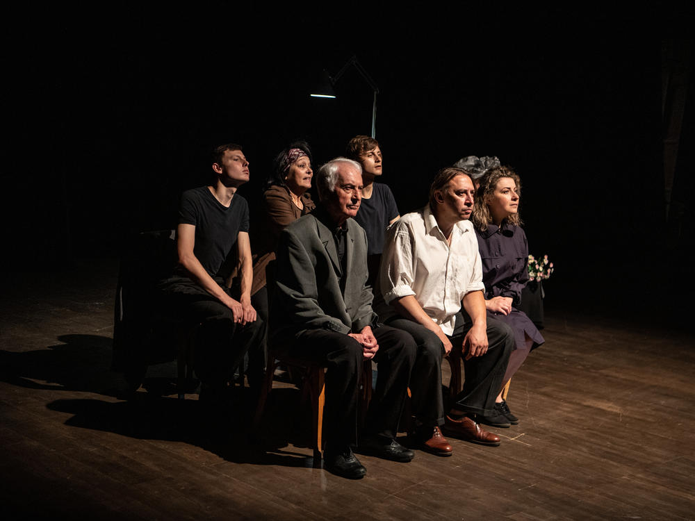 Actors for the Donetsk Regional Drama Theatre of Mariupol, on stage during a rehearsal for their play <em>Cry of a Nation</em> at the Uzhhorod municipal theater on July 14.