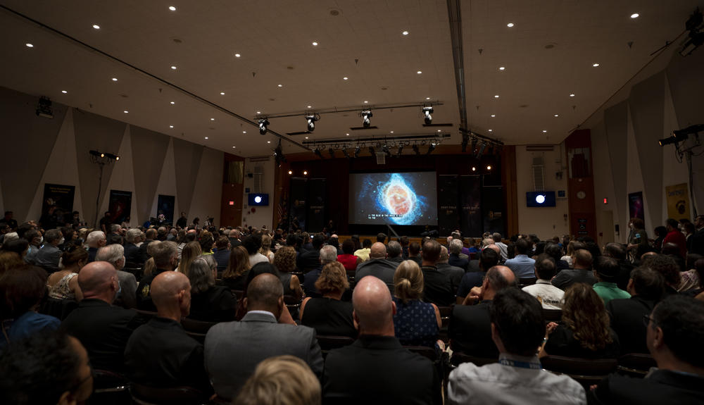 A crowd at NASA's Goddard Space Flight Center in Greenbelt, Md. watched as some of the first images got released on July 12.