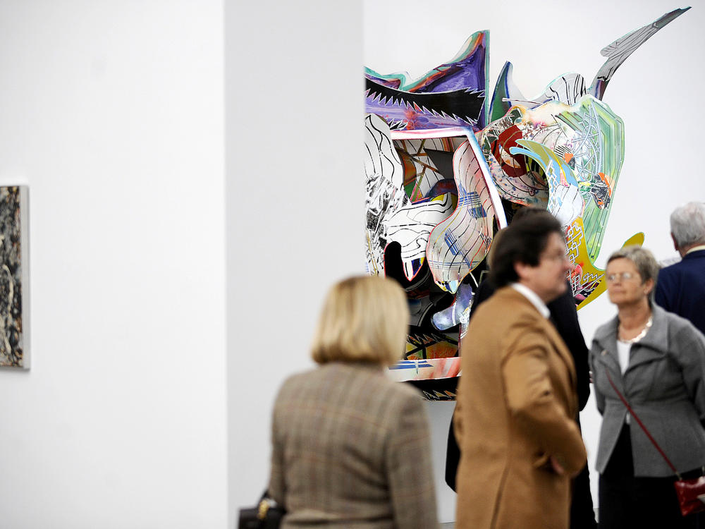Visitors walk past the installation <em>The Honor and Glory of Whaling</em> (1991) by Frank Stella in the Folkwang Museum in Essen, Germany, in 2010.