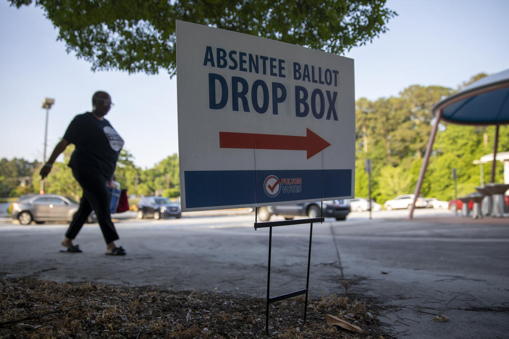 A sign indicates that an absentee ballot drop box is available to voters outside a Fulton County early voting site at C.T. Martin Natatorium and Recreation Center in Atlanta on May 18.