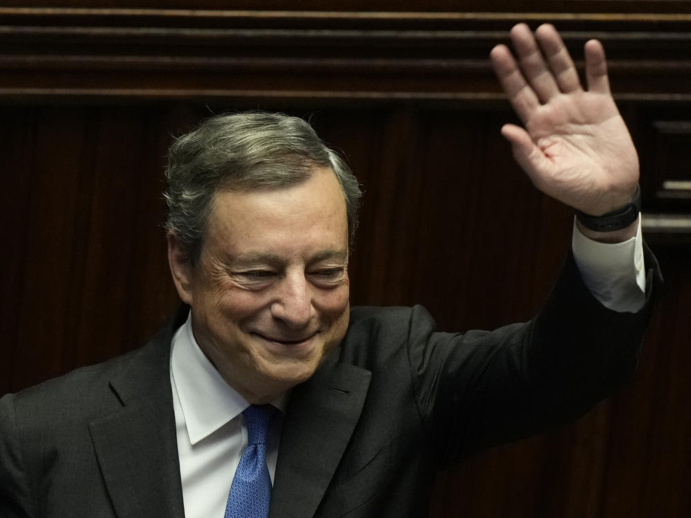 Italian Premier Mario Draghi waves to lawmakers at the end of his address at the Parliament in Rome on Thursday.