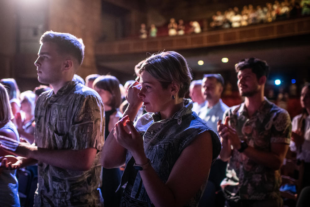 An audience member cries at the end of the second performance of 