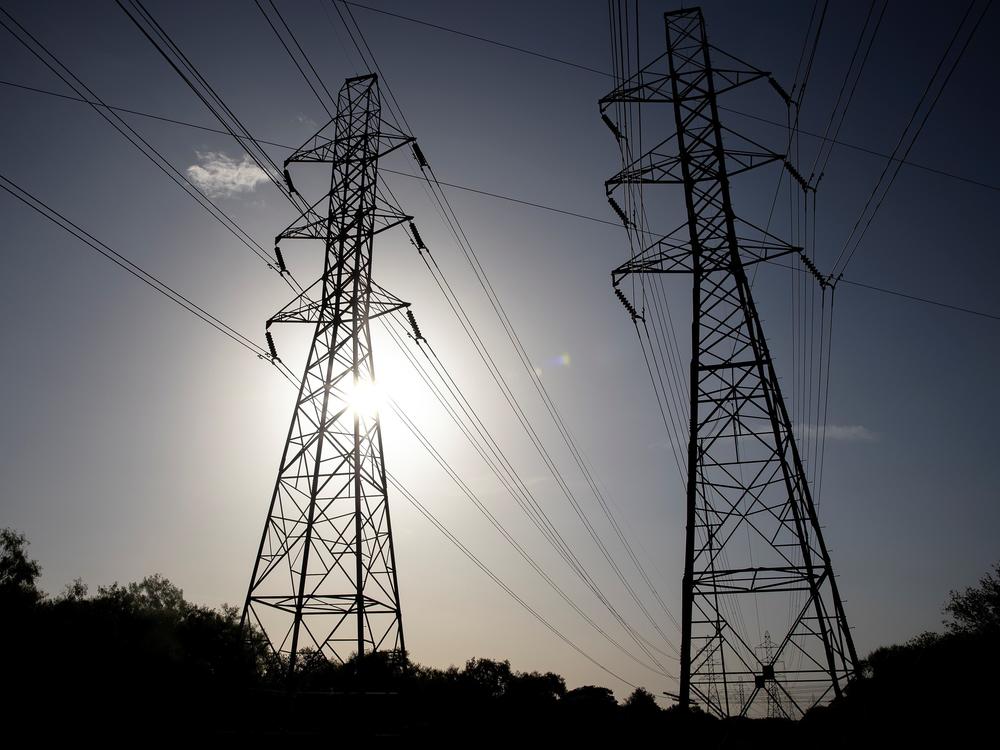 Power transmission lines span toward San Antonio, Texas. More than 100 million people are currently under heat-related warnings and advisories across the United States, the National Weather Service Weather Prediction Center said Tuesday.