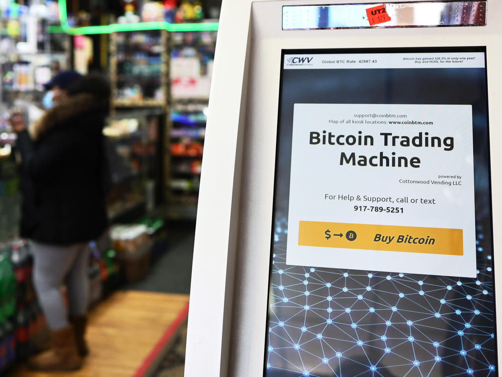 Tesla has pulled back from its $1.5 billion investment in Bitcoin, which it announced in early 2021. Here, a Bitcoin ATM is seen last year inside a New York City store.