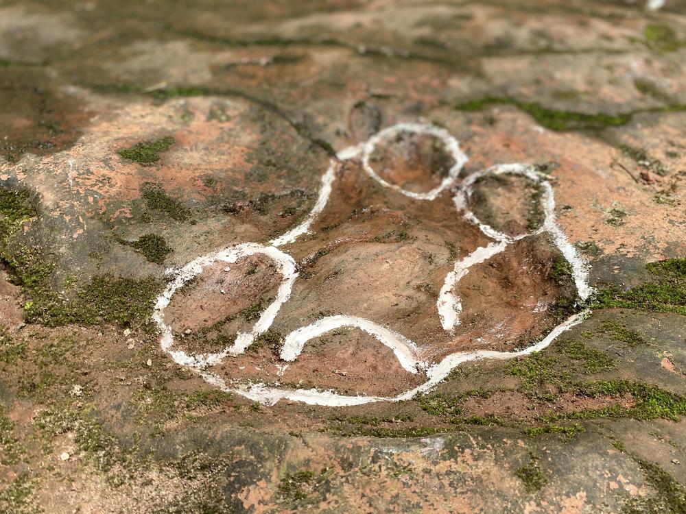 One outline of a footprint discovered in the restaurant courtyard.
