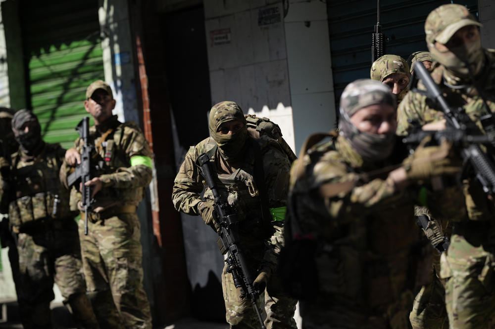 Police conduct an operation in the Complexo do Alemao favela in Rio de Janeiro on Thursday.
