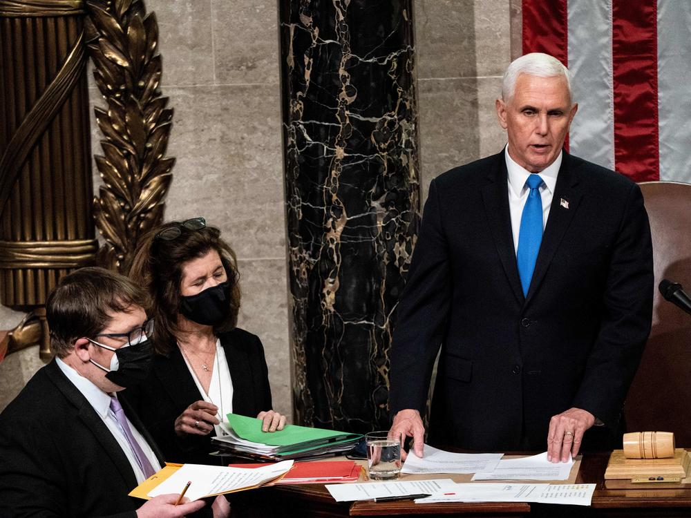 Then-Vice President Mike Pence is seen presiding over a joint session of Congress to certify the 2020 Electoral College results after a mob of pro-Trump supporters stormed the Capitol. Proposed changes to the Electoral Count Act would clarify the vice president's role in counting states' electoral votes.
