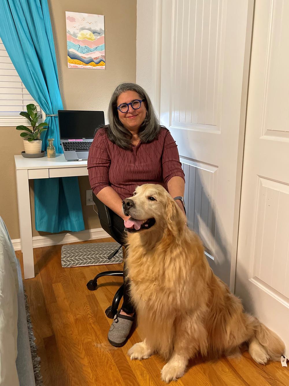 Jenn Ramirez Robson works from home with her office companion, Dickens.