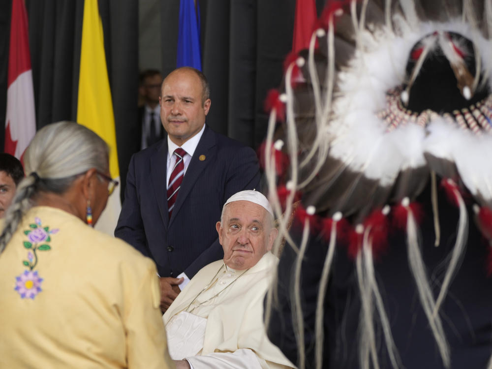 Pope Francis meets the Canadian Indigenous people as he arrives at Edmonton's International airport, Canada, on Sunday.