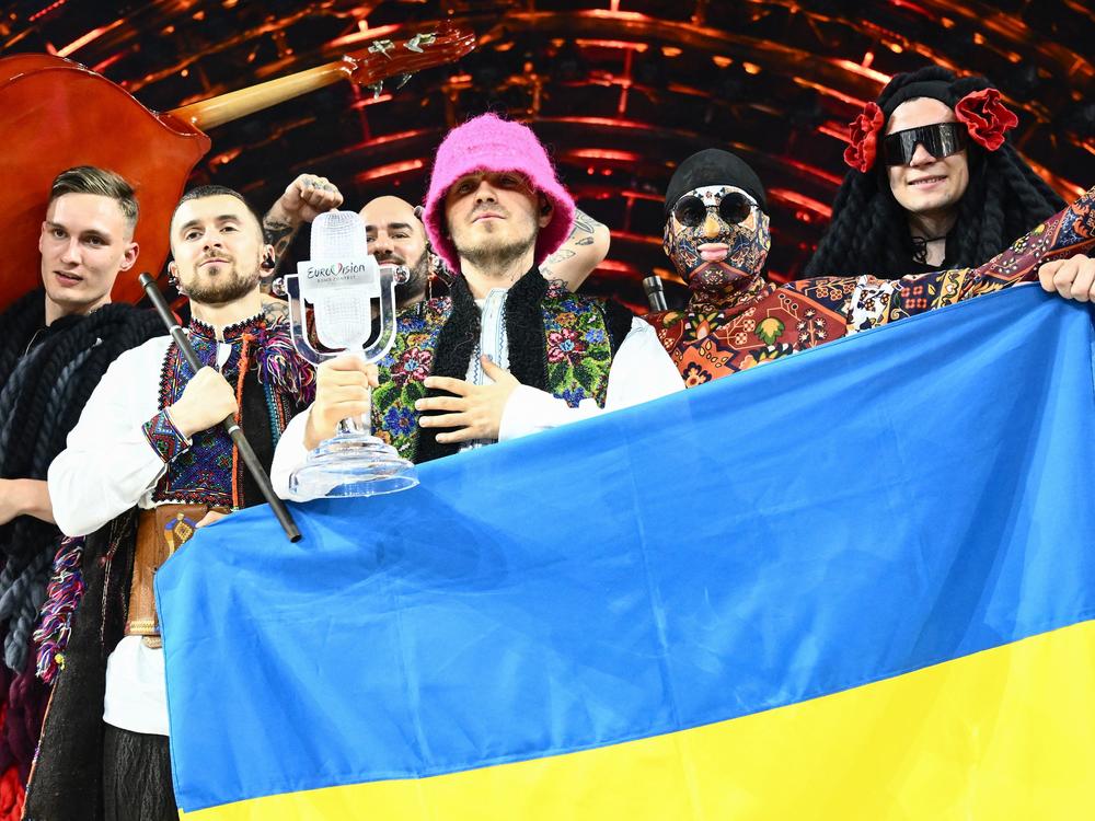 Members of the Ukrainian band Kalush Orchestra pose onstage after winning the Eurovision Song Contest on May 14 in Turin, Italy. The winning country typically hosts the next year's competition, but Russia's war in Ukraine has disrupted that tradition.