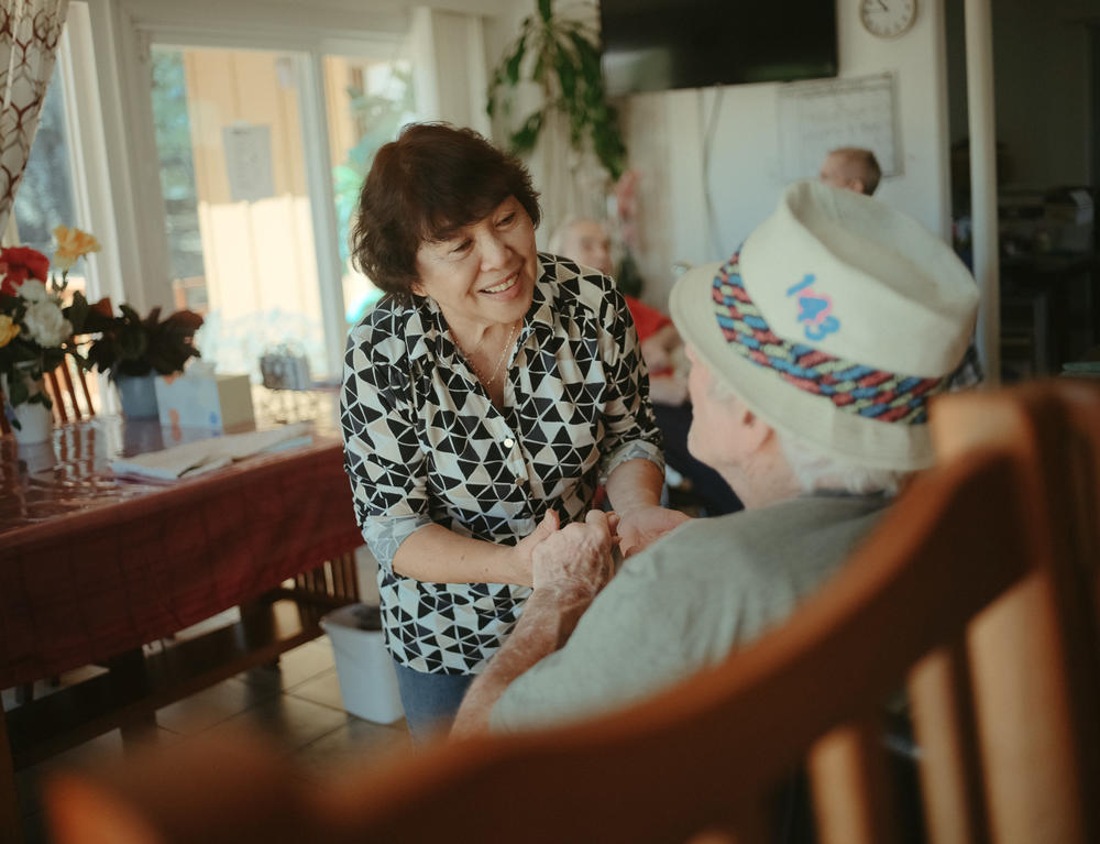 Perez sings to one of the residents at Hillcrest Care, the small assisted-living facility she owns in El Dorado Hills, Calif., first thing in the morning. Perez says the gesture keeps the mood light and residents' spirits up.