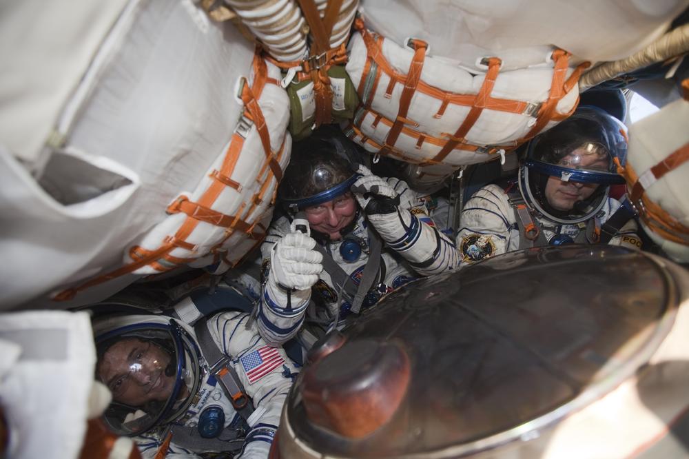 International Space Station crew members U.S. astronaut Joseph Acaba (from left) and Russian cosmonauts Gennady Padalka and Sergei Revin sit inside a Soyuz capsule shortly after landing near the town of Arkalyk in northern Kazakhstan Sept. 17, 2012.