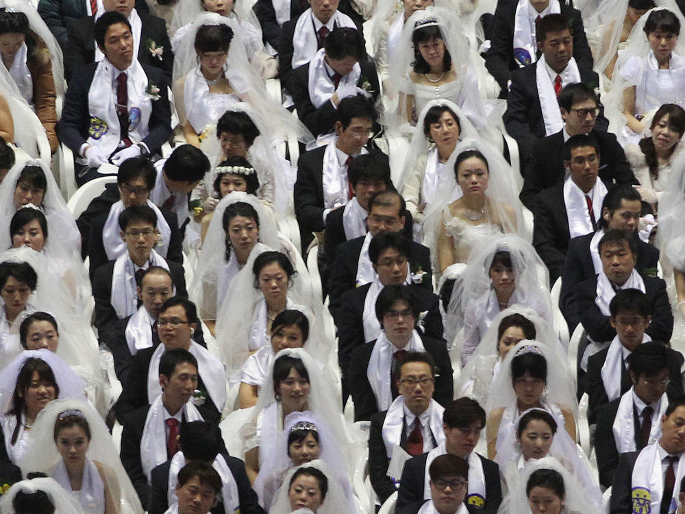 Couples from around the world participate in a mass wedding ceremony arranged by the Unification Church, at the CheongShim Peace World Center in Gapyeong, South Korea, in 2014.