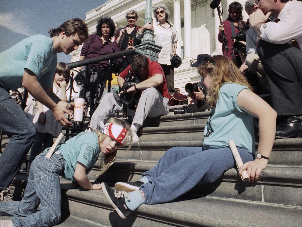 A group of disabled people led by 8-year-old Jennifer Keelan (left) crawl up the steps of the U.S. Capitol in Washington in March 1990 to draw support for a key bill pending in the House that would extend civil rights to disabled persons.