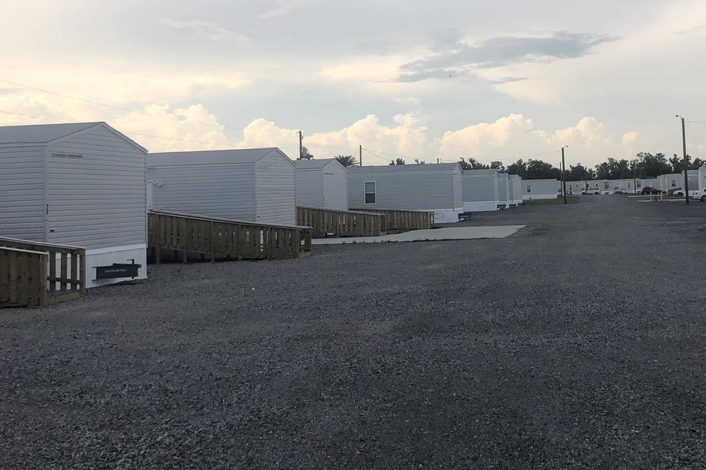 FEMA trailers set up on a gravel lot south of Houma provide shelter for people displaced by Hurricane Ida, including residents of a public housing complex that was condemned.