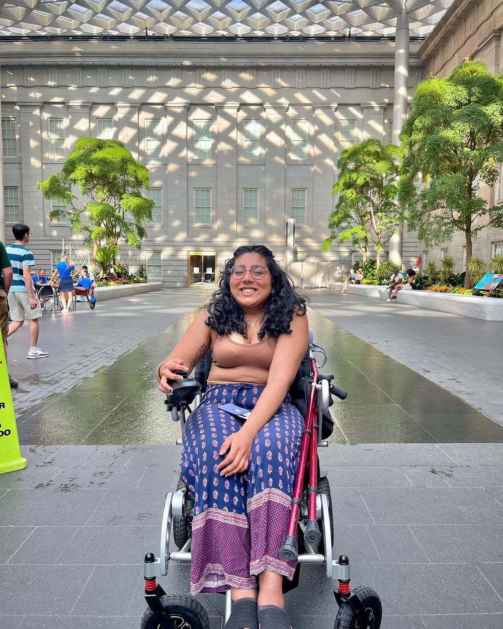 Shruti Rajkumar sitting in a wheelchair at a museum in Washington, D.C.