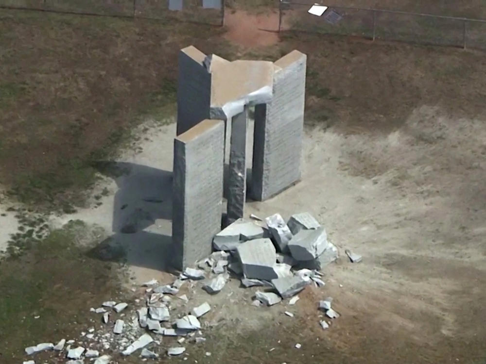 Rubble is cast around the Georgia Guidestones after an explosion in Elberton, Georgia, U.S., July 6, 2022 in a still image from video.