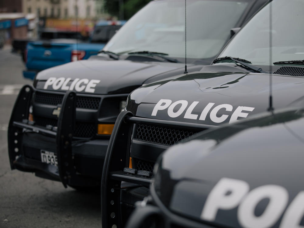 Police vehicles are parked outside the headquarters of the Yonkers Police Department in Yonkers, N.Y. Since 2007, the U.S. Department of Justice has been investigating the Yonkers Police Department and recommending areas for reform.