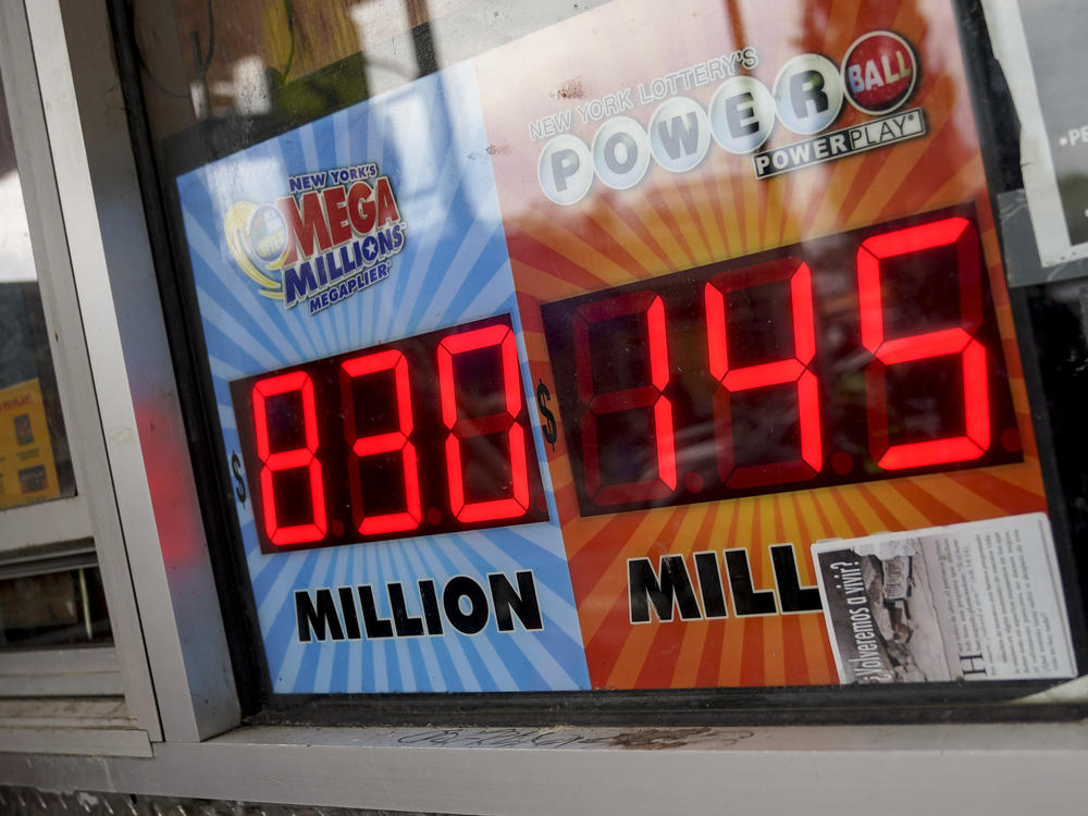 The Mega Millions lottery jackpot is advertised outside a smoke shop in the Bushwick neighborhood in the Brooklyn borough of New York, Tuesday, July 26, 2022.