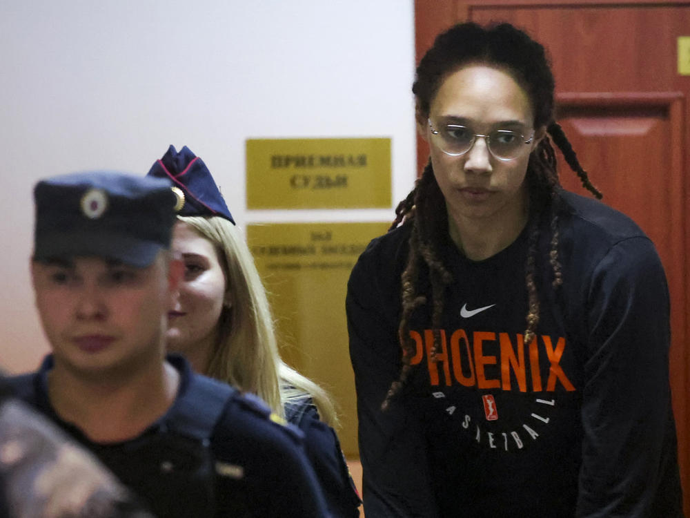 WNBA star and two-time Olympic gold medalist Brittney Griner is escorted to a courtroom for a hearing, in Khimki just outside Moscow, on Wednesday.
