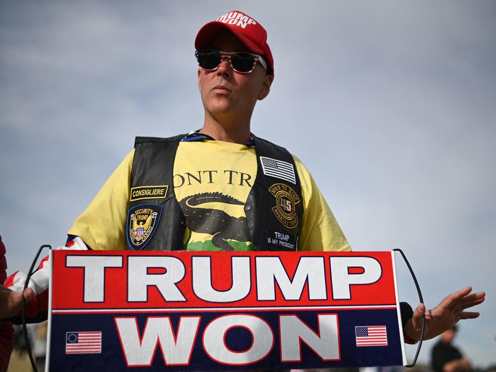 A Donald Trump supporter holds a 