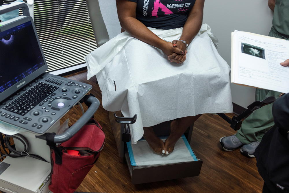 The clinic doctor at Houston Women's Reproductive Services  discusses ultrasound results with a patient in Texas, Oct. 1, 2021.