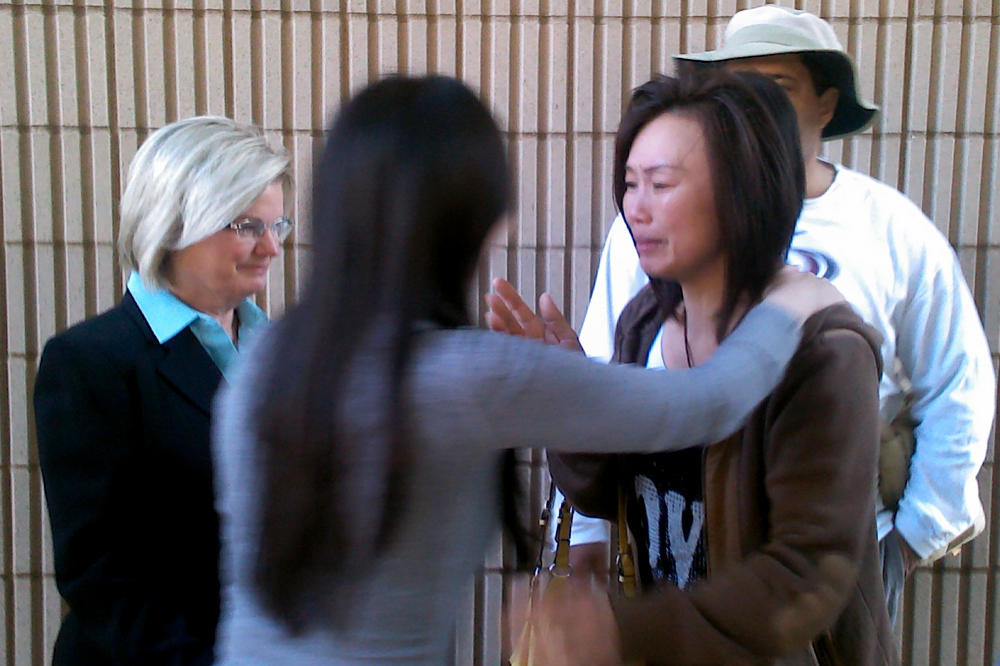 Bei Bei Shuai, second from left, hugs her friend, after Shuai's release on bail from the Marion County Jail in Indianapolis on May 22, 2012.