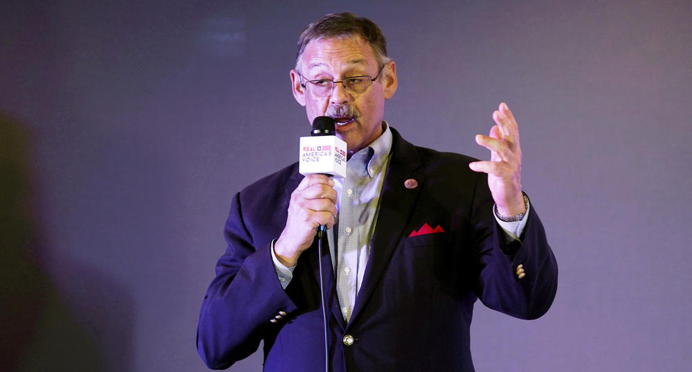 Arizona state Rep. Mark Finchem speaks during an election rally in Richmond, Va., on Oct. 13, 2021. Finchem is now running for Arizona secretary of state, with Trump's endorsement.