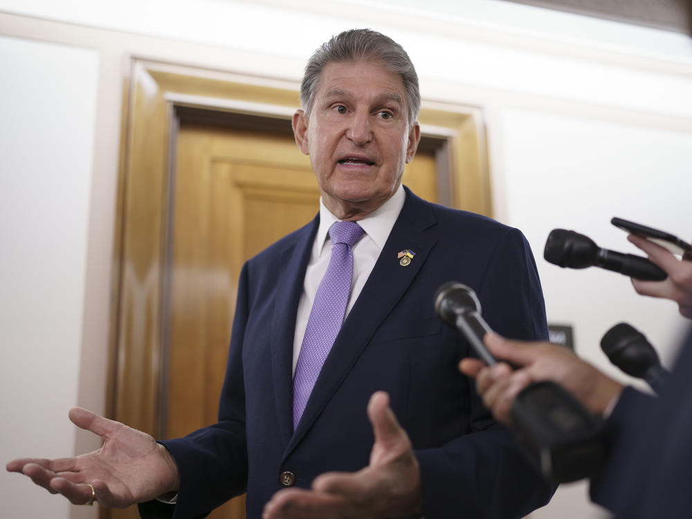 Sen. Joe Manchin, D-W.Va., is met by reporters outside the hearing room where he chairs the Senate Committee on Energy and Natural Resources, at the Capitol in Washington, D.C., last week.