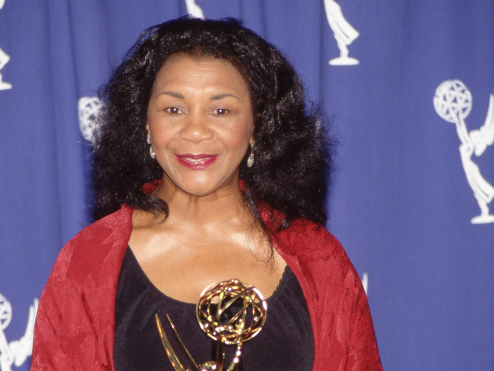 Actress Mary Alice holding her Emmy Award in the press room in 1993.