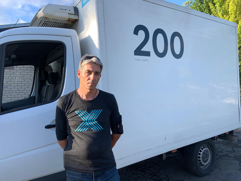 Oleg Repnoy stands in front of his Evacuation 200 vehicle. 