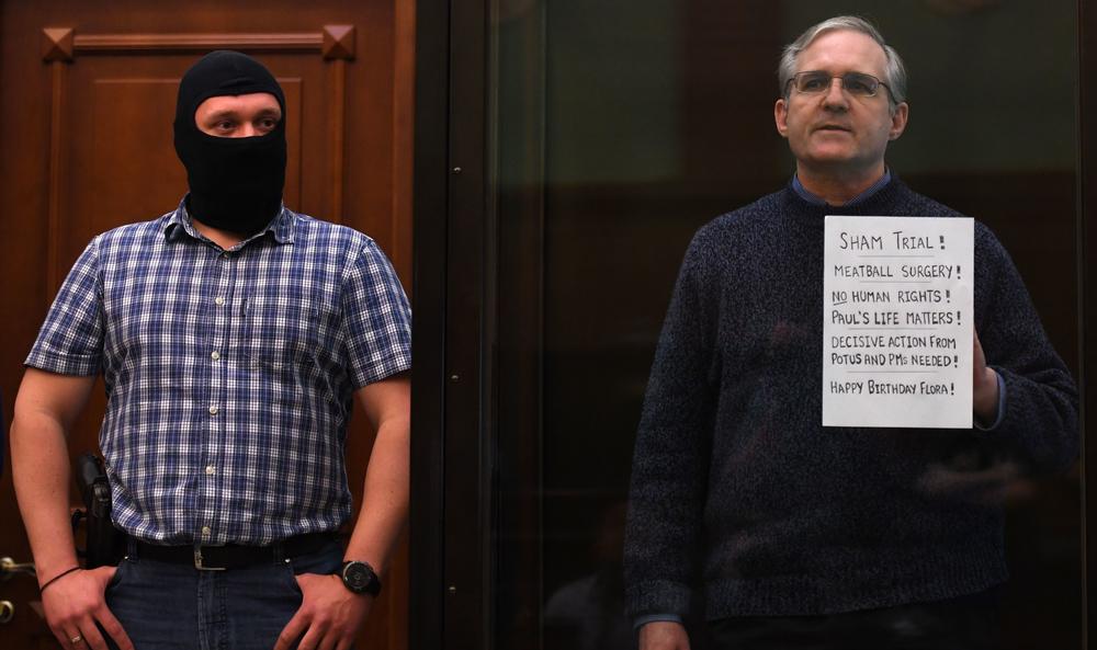 American Paul Whelan, who was arrested in Russia in 2018 and charged with espionage, stands inside the defendant's cage as he awaited his verdict in 2020. He was convicted and sentenced to 16 years.
