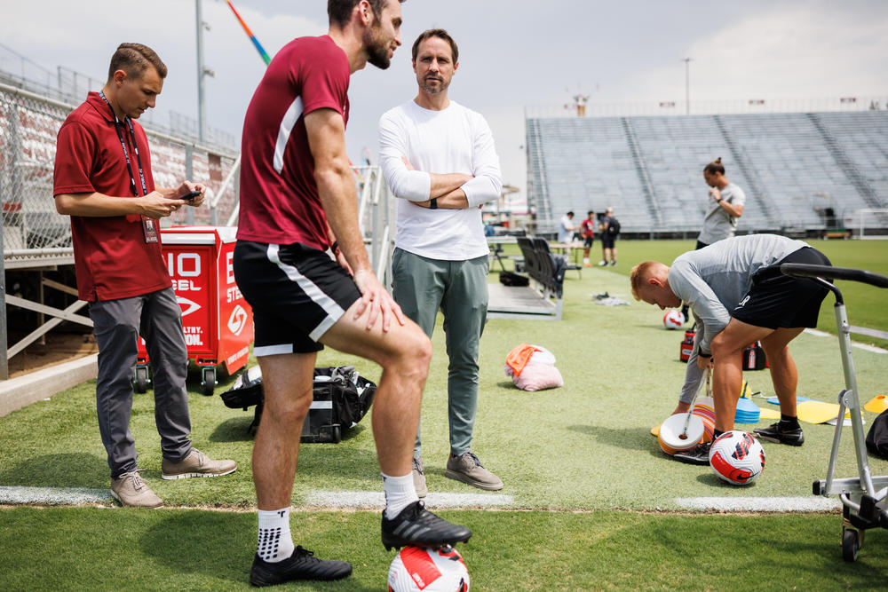 Sacramento Republic FC president and general manager Todd Dunivant talks to players after practice.