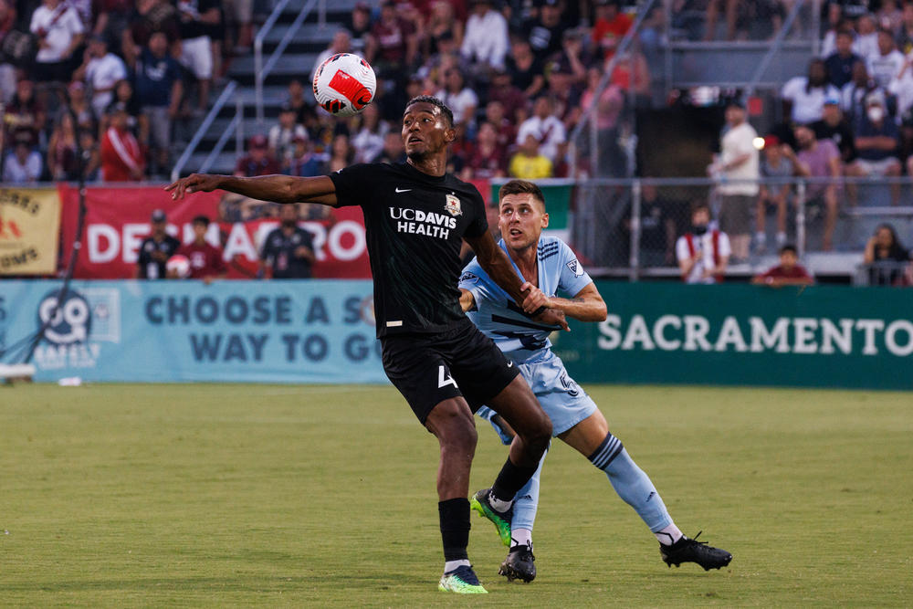 Sacramento Republic's Douglas Martinez Jr., left, and Sporting Kansas City's Rémi Walter battle for the ball during their U.S. Open semifinal game.