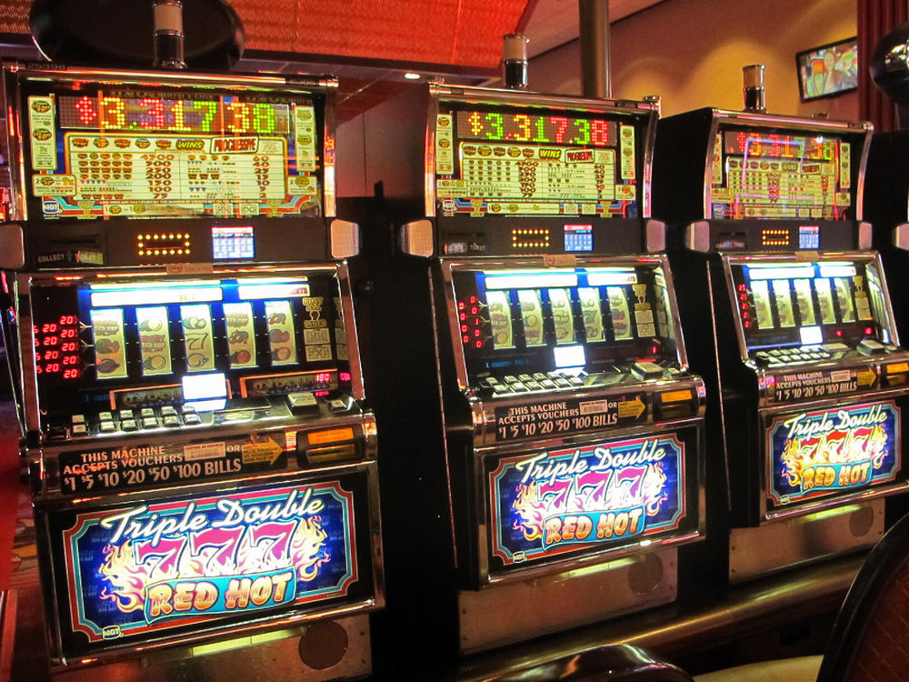 In this June 23, 2021 photo, a row of slot machines sit empty at Bally's casino in Atlantic City N.J.