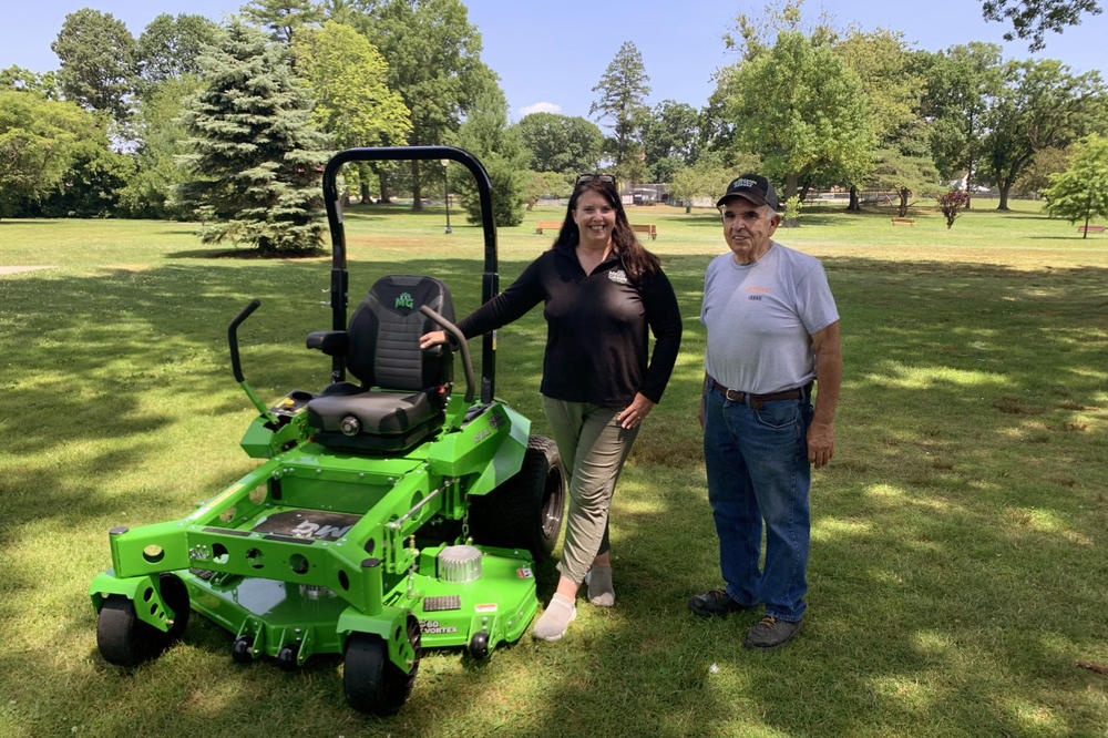 Mean Green Mowers, a 10-year-old electric lawn mower company based in Ohio, sells commercial-grade ride-on lawn mowers with long-lasting batteries. Jen Stroker (left), regional development manager for the company, and Raymond Rocco, co-owner of C.R. Power, which sells the products, demonstrated the Rival model in a Port Chester, N.Y., park recently.