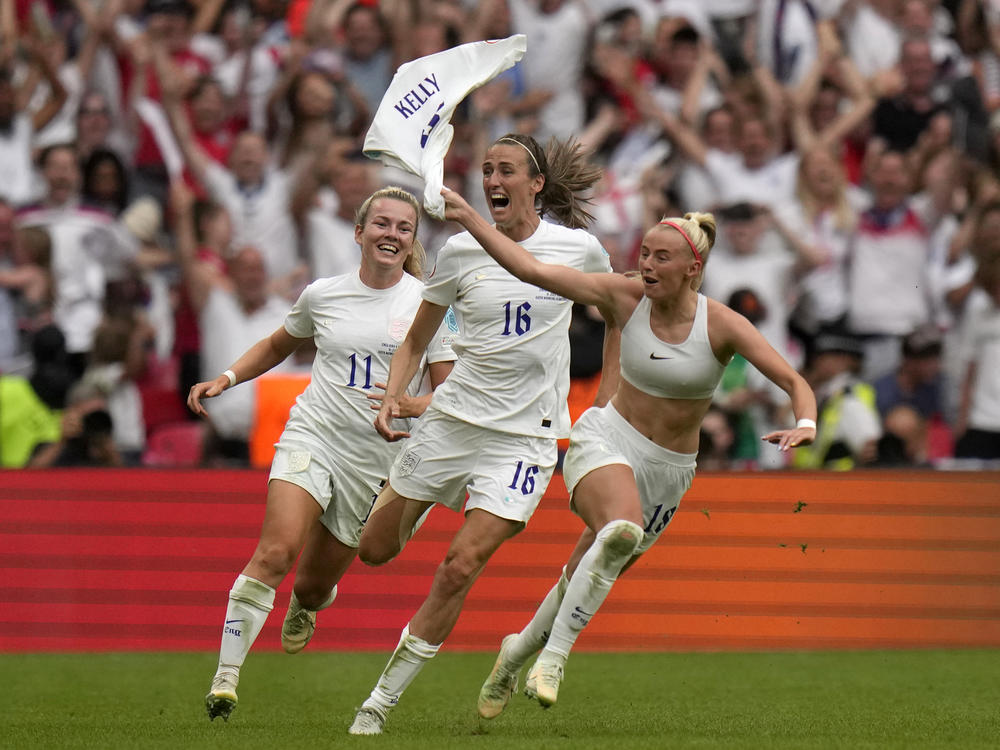 England's Chloe Kelly, right, celebrates after scoring her side's second goal during the women's Euro 2022 final soccer match against Germany at London's Wembley stadium on Sunday.