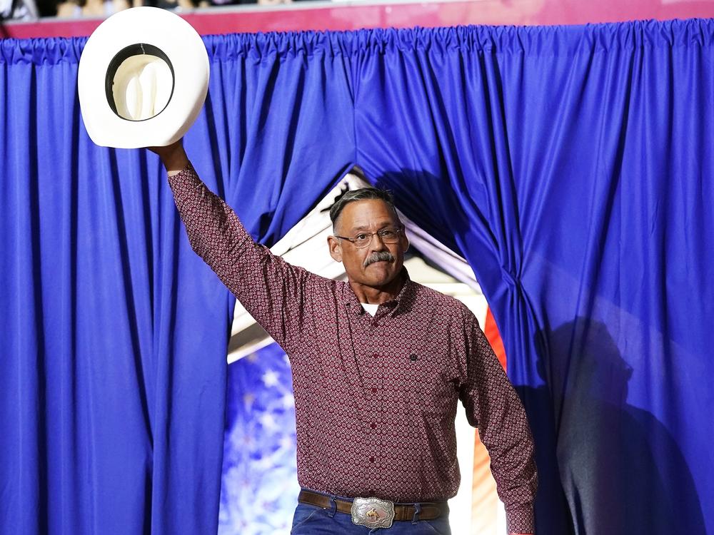 Mark Finchem, a Republican candidate for Arizona secretary of state, waves to the crowd as he arrives to speak at a rally put on by former President Donald Trump in Arizona on July 22.