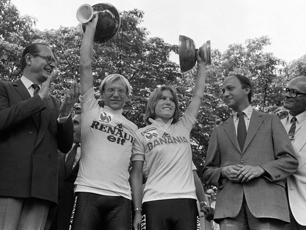 Marianne Martin stands alongside fellow Tour de France winner Laurent Fignon on the podium in Paris on July 22, 1984. Martin received around $1,000 for her win; Fignon got more than $100,000.