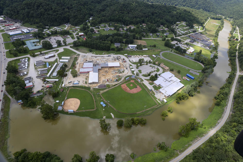 In this aerial image, the river is still high around the homes in Breathitt County, Ky., on Saturday.