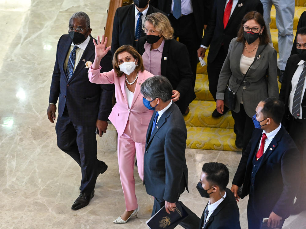This photo from Malaysia's Department of Information, U.S. House Speaker Nancy Pelosi, center, waves to media as she tours the parliament house in Kuala Lumpur, Tuesday, Aug. 2, 2022.