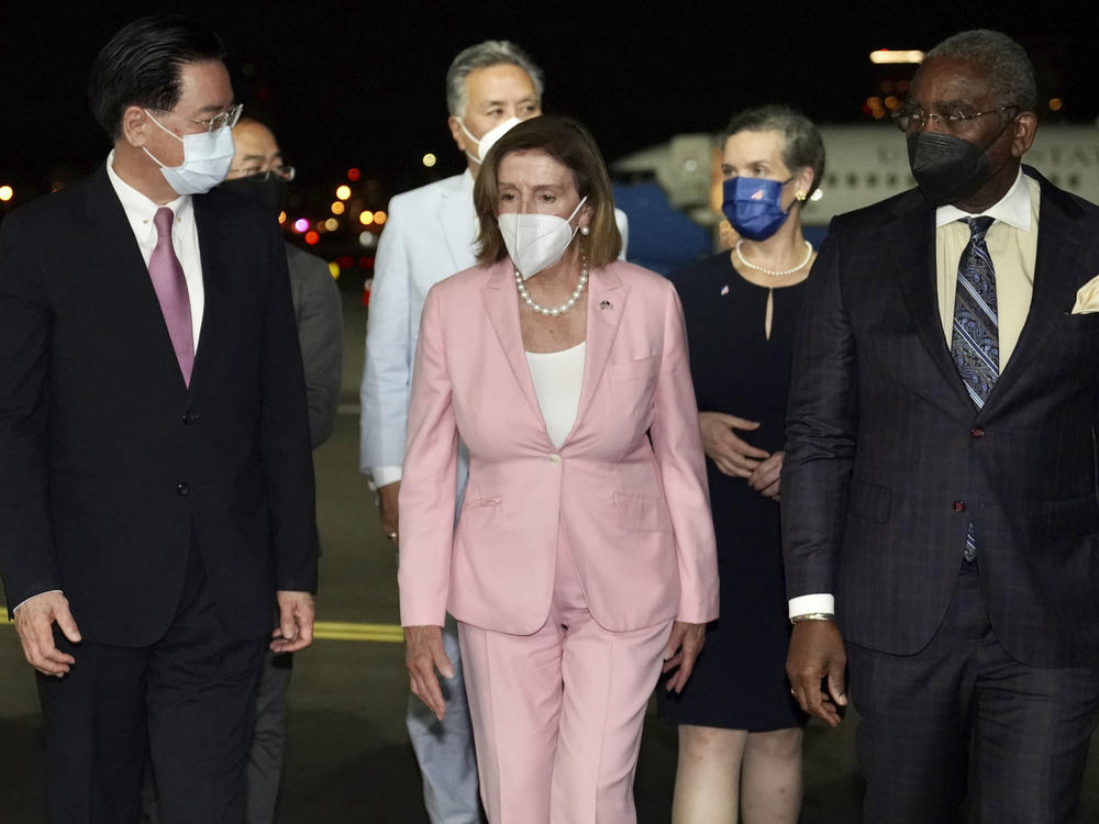 In this photo released by the Taiwan Ministry of Foreign Affairs, U.S. House Speaker Nancy Pelosi walks with Taiwan's Foreign Minister Joseph Wu as she arrives in Taipei, Taiwan, on Tuesday, despite threats from Beijing of serious consequences, becoming the highest-ranking American official to visit the self-ruled island claimed by China in 25 years.