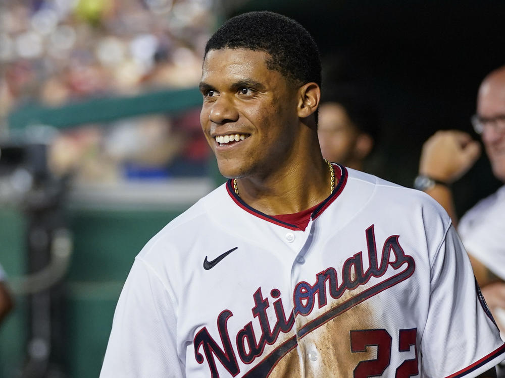 Washington Nationals' Juan Soto smiles in the dugout after a solo home run against the New York Mets at Nationals Park on Monday in Washington.