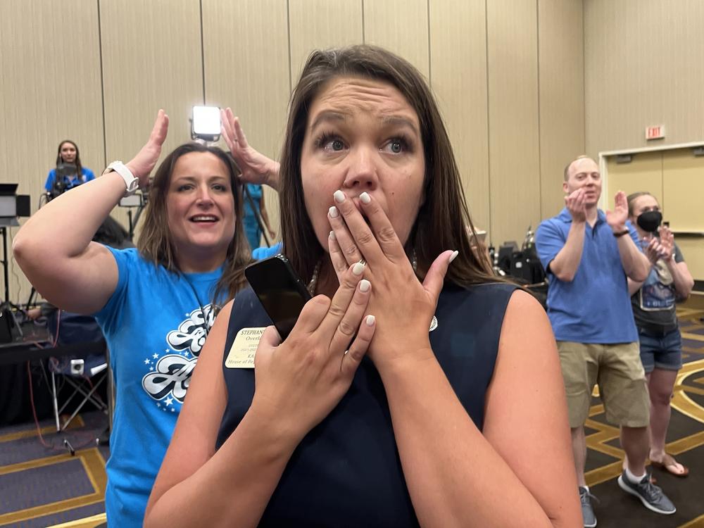 Kansas state Rep. Stephanie Clayton, an abortion rights supporter who was a Republican and is now a Democrat, reacts as a referendum to strip abortion rights out of the state constitution fails.