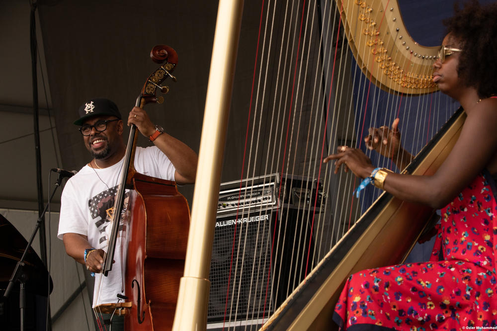Christian McBride (left) and Brandee Younger perform onstage.