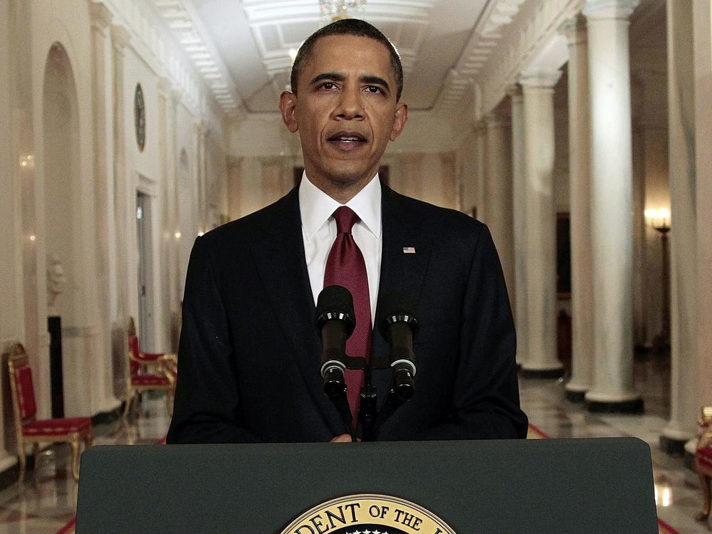 President Barack Obama reads his statement to photographers after making a televised statement on the death of Osama bin Laden from the East Room of the White House on May 1, 2011.