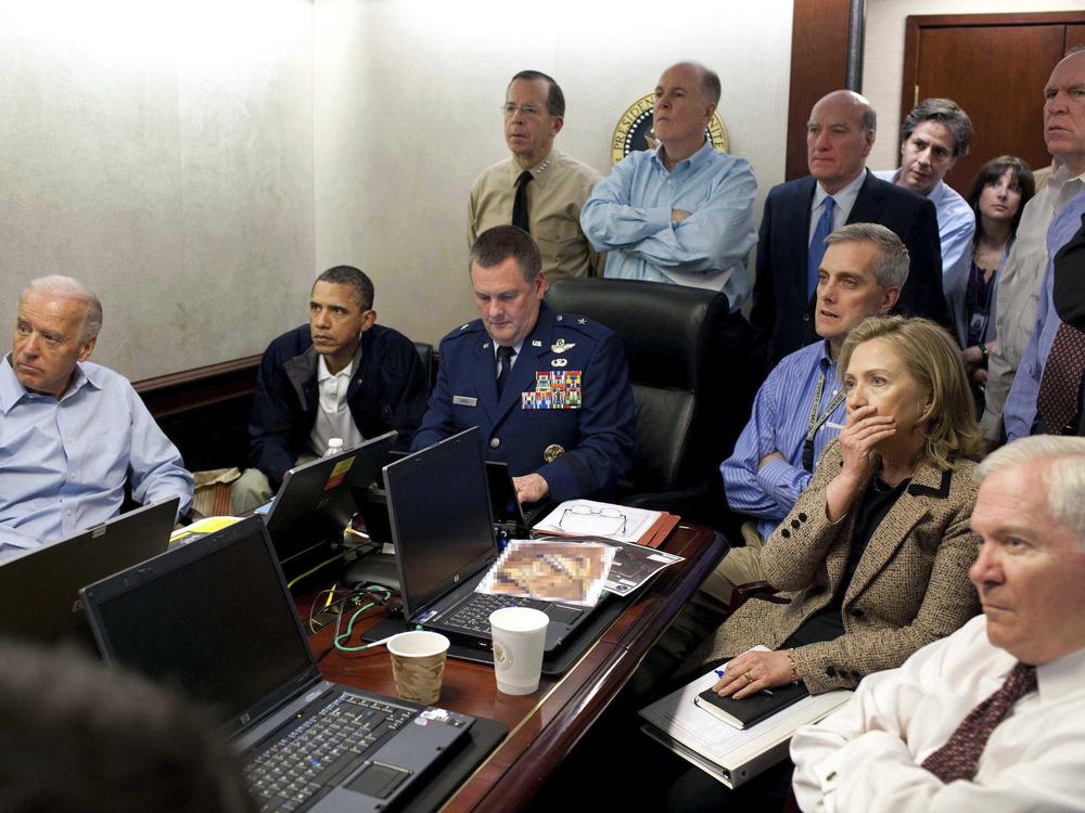 In this image released by the White House and digitally altered by the source to diffuse the paper in front of Secretary of State Hillary Rodham Clinton, President Barack Obama and then-Vice President Joe Biden, along with with members of the national security team, receive an update on the mission against Osama bin Laden in the Situation Room of the White House on May 1, 2011.