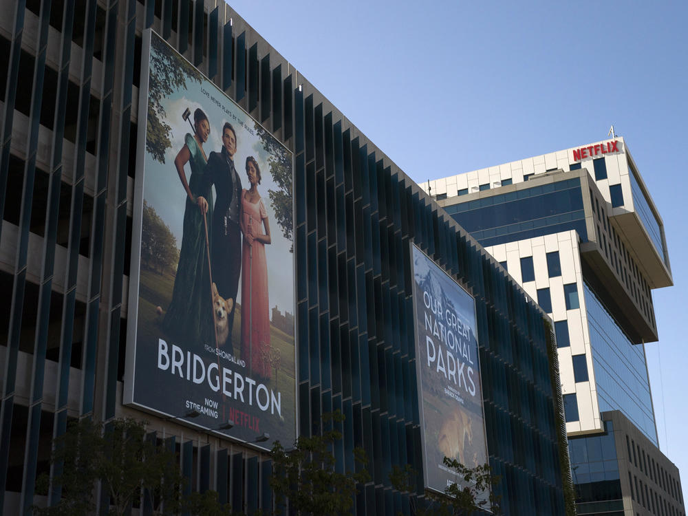 An advertisement for Netflix's popular show <em>Bridgerton</em> is seen outside its office building in Los Angeles, in April.