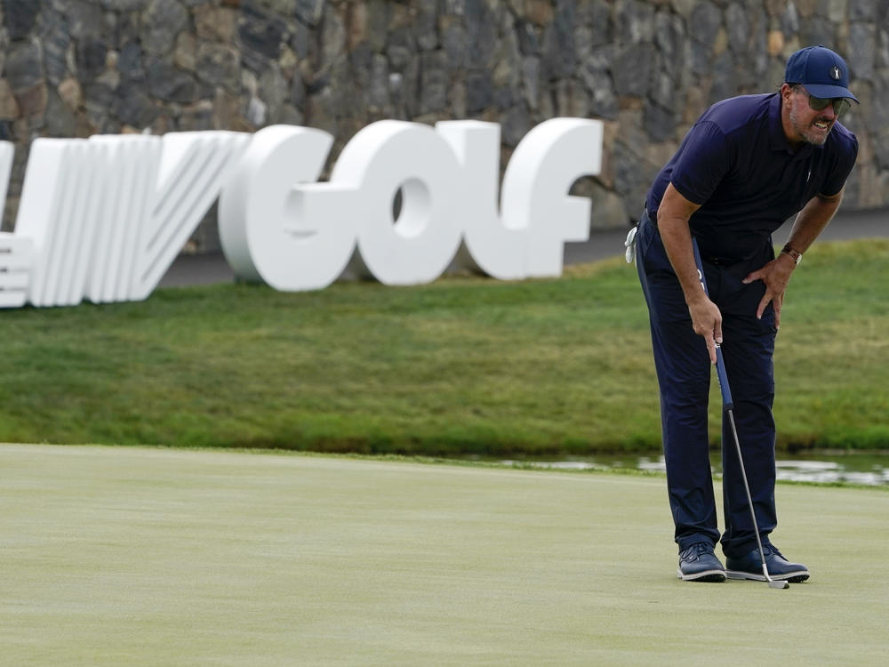 Phil Mickelson lines up a shot on the 18th hole during the first round of the Bedminster Invitational LIV Golf tournament in Bedminster, N.J., on Friday.