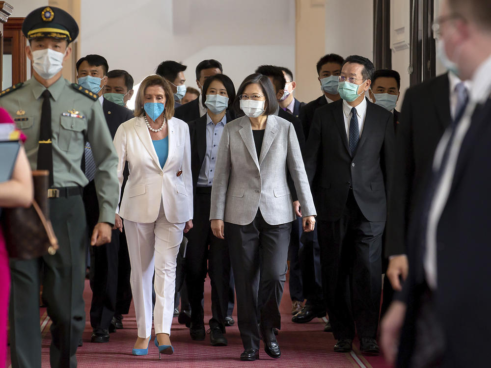 U.S. House Speaker Nancy Pelosi, center left, and Taiwanese President President Tsai Ing-wen arrive for a meeting in Taipei, Taiwan, Wednesday, Aug. 3, 2022.
